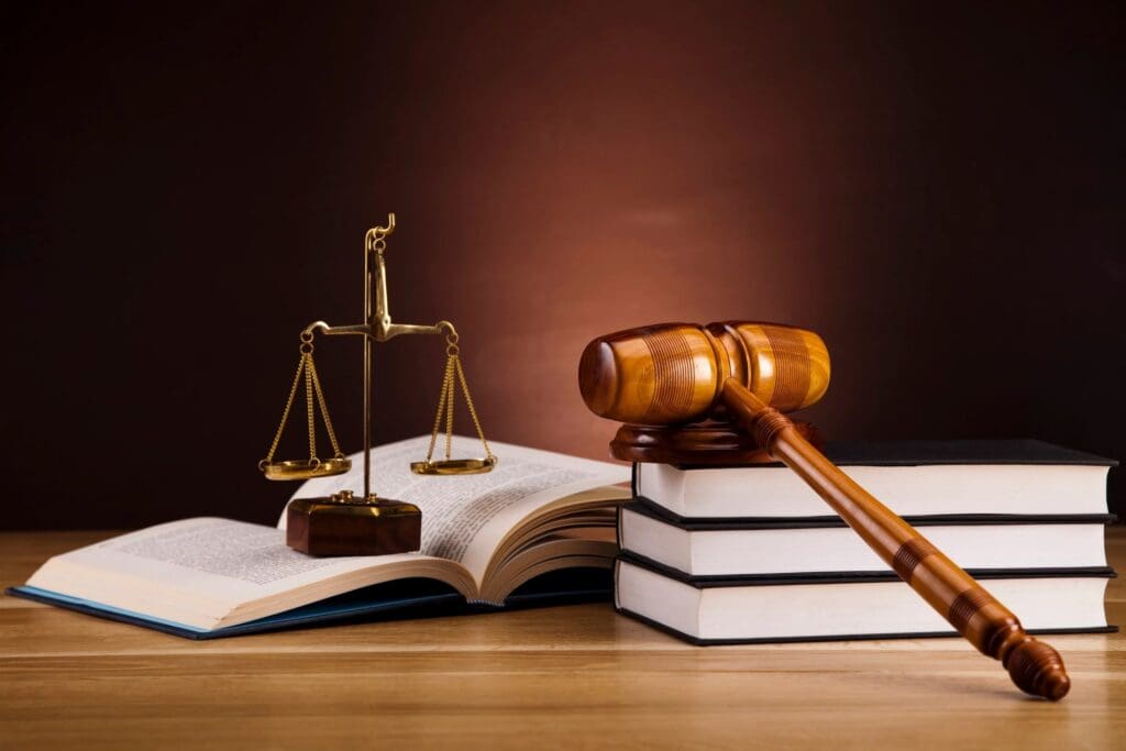 Gavel and scales atop open law book