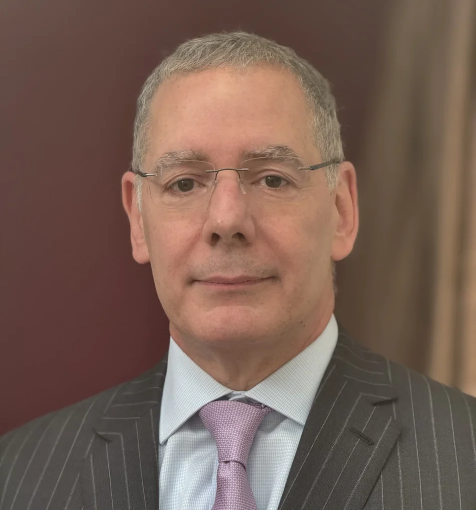 Close-up of man wearing glasses and tie